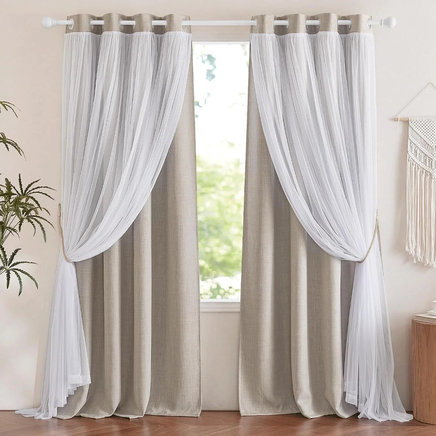 Beige linen curtains layered with white sheer drapes on a grommet rod by a bright window