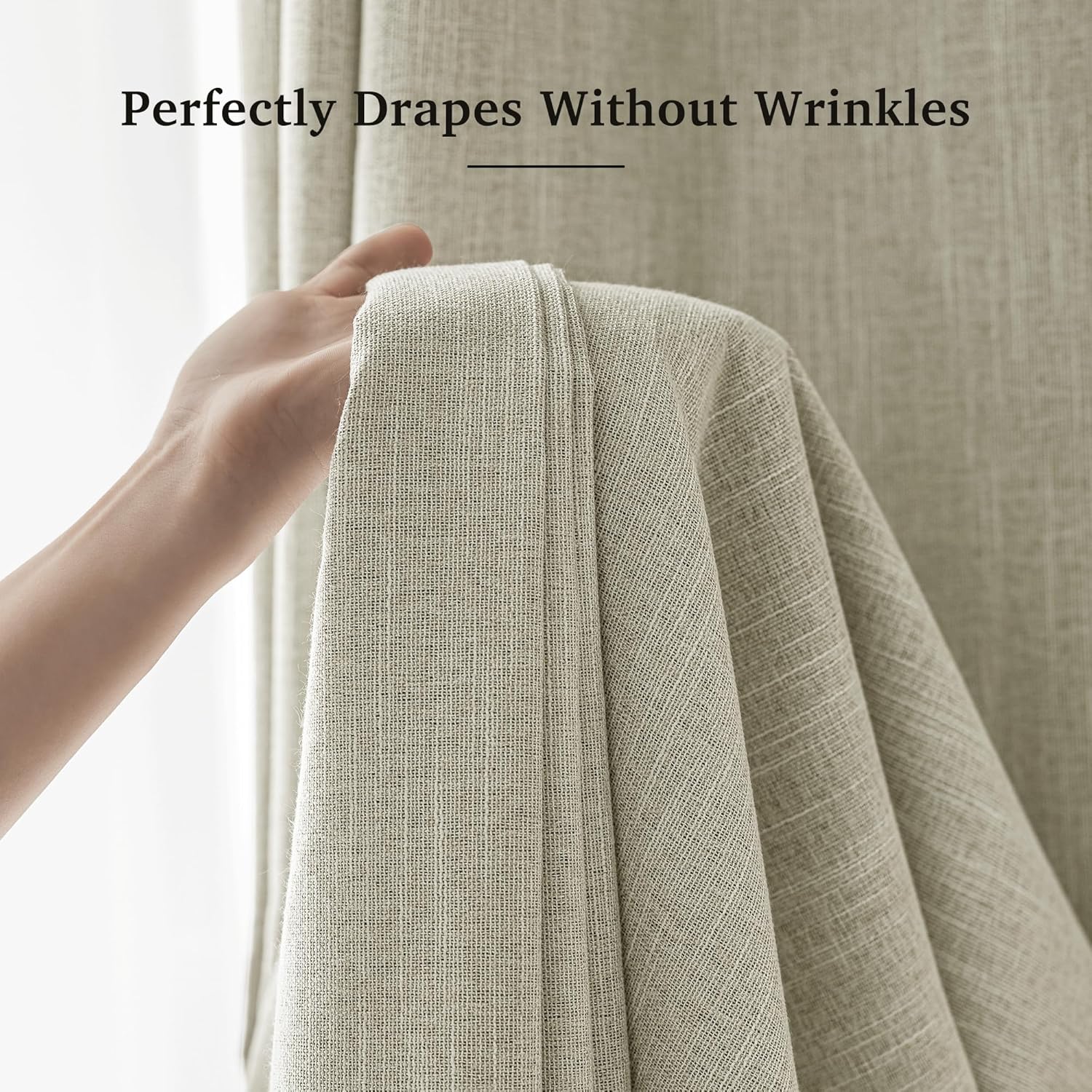 Hand holding light beige textured curtain fabric, showcasing its natural weave and wrinkle-free drape.