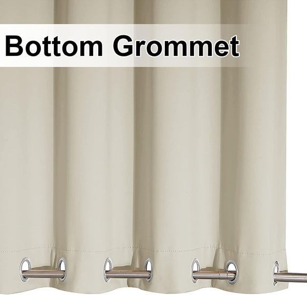 Light beige opaque curtain with silver bottom grommets and a metal rod threaded through.