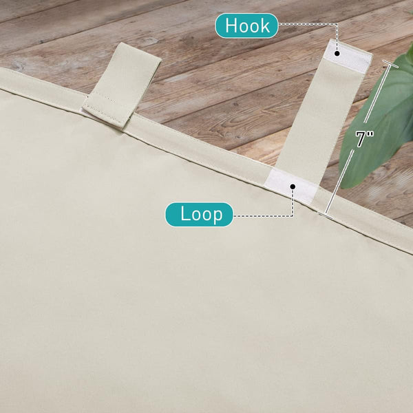 Close-up of beige outdoor fabric with 7-inch hook and loop strap closure, against wooden floor and green plant.