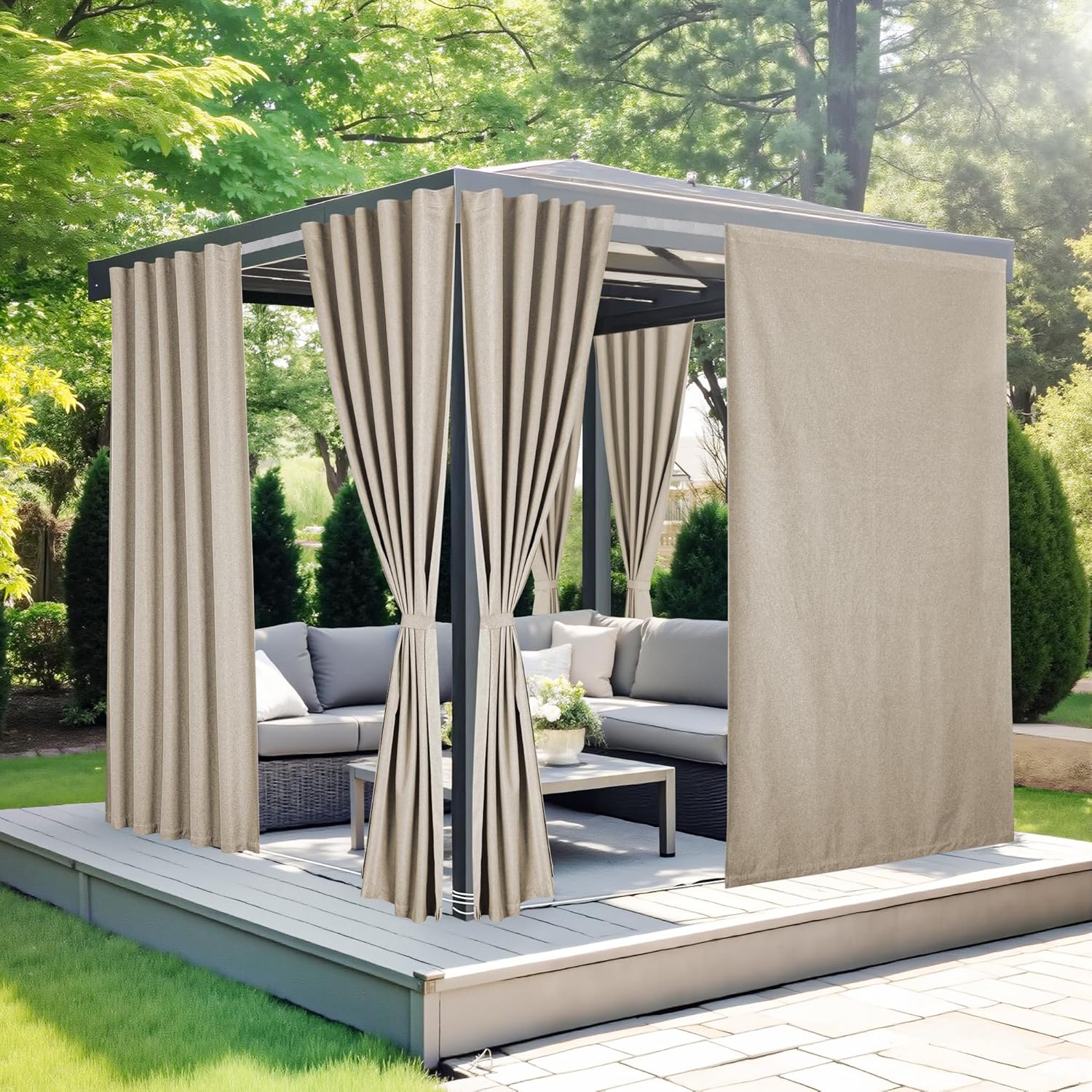 Beige outdoor privacy curtains with grommet tops, tied back and closed, hanging on a grey gazebo.