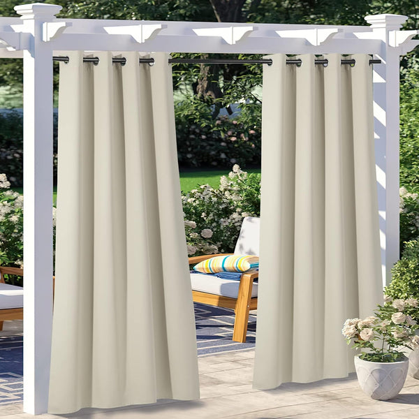 Pair of light beige outdoor patio curtains with black grommet tops on a white pergola, offering privacy.