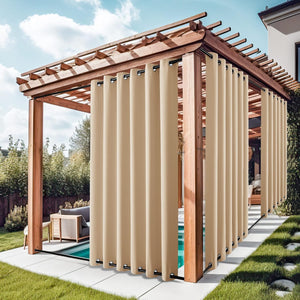 Beige outdoor privacy curtains with black grommets on top and bottom rods enclosing a wooden pergola by a pool.