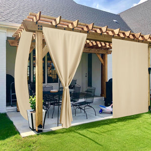 Beige outdoor privacy panels attached to a wooden pergola, providing shade and privacy for a backyard patio.