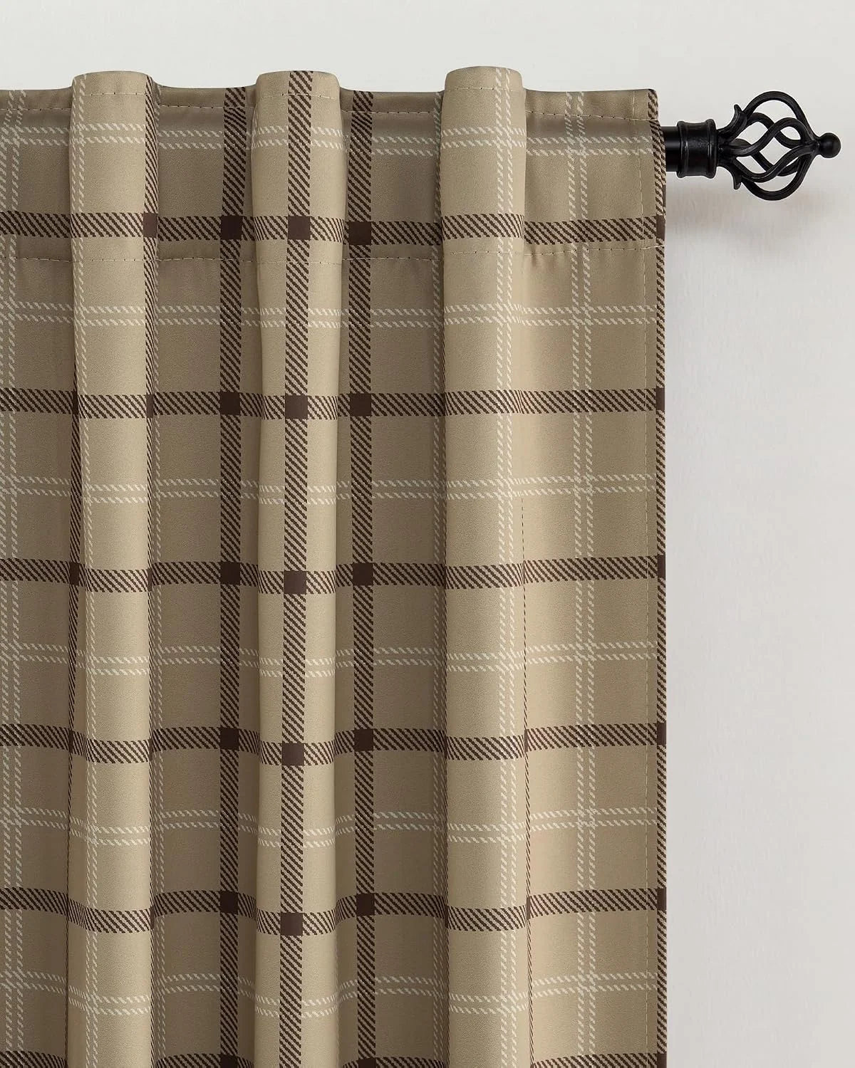 Beige plaid curtain panel with rod pocket top on a black decorative curtain rod