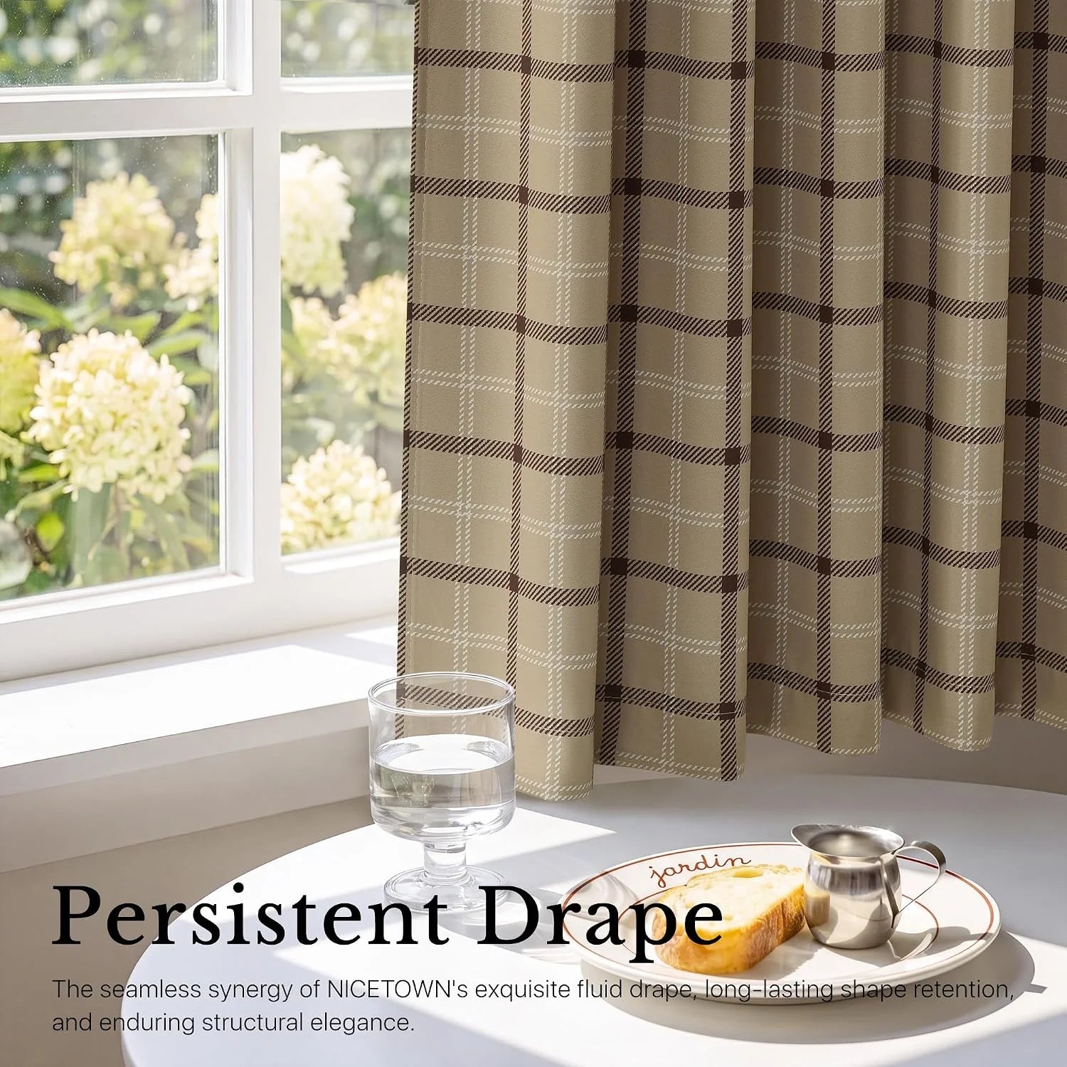 Beige plaid curtains beside a bright white window with breakfast table styling