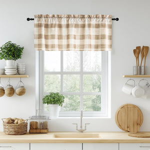 Beige and off-white plaid valance with rod pocket hanging on a kitchen window.