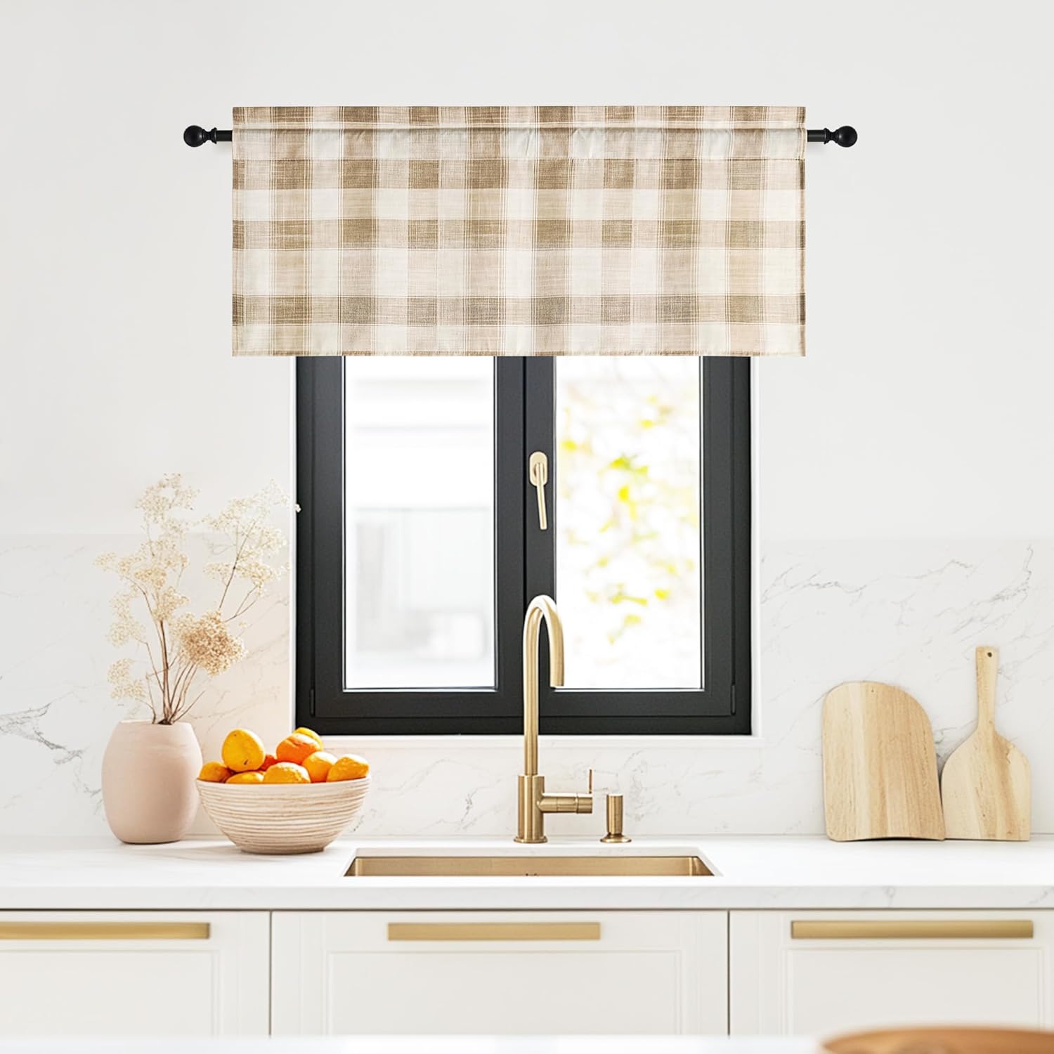 Beige and off-white plaid rod pocket valance hanging on a black rod above a modern kitchen sink.