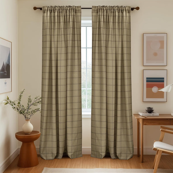 Pair of light beige curtains with subtle windowpane plaid pattern and rod pocket top.