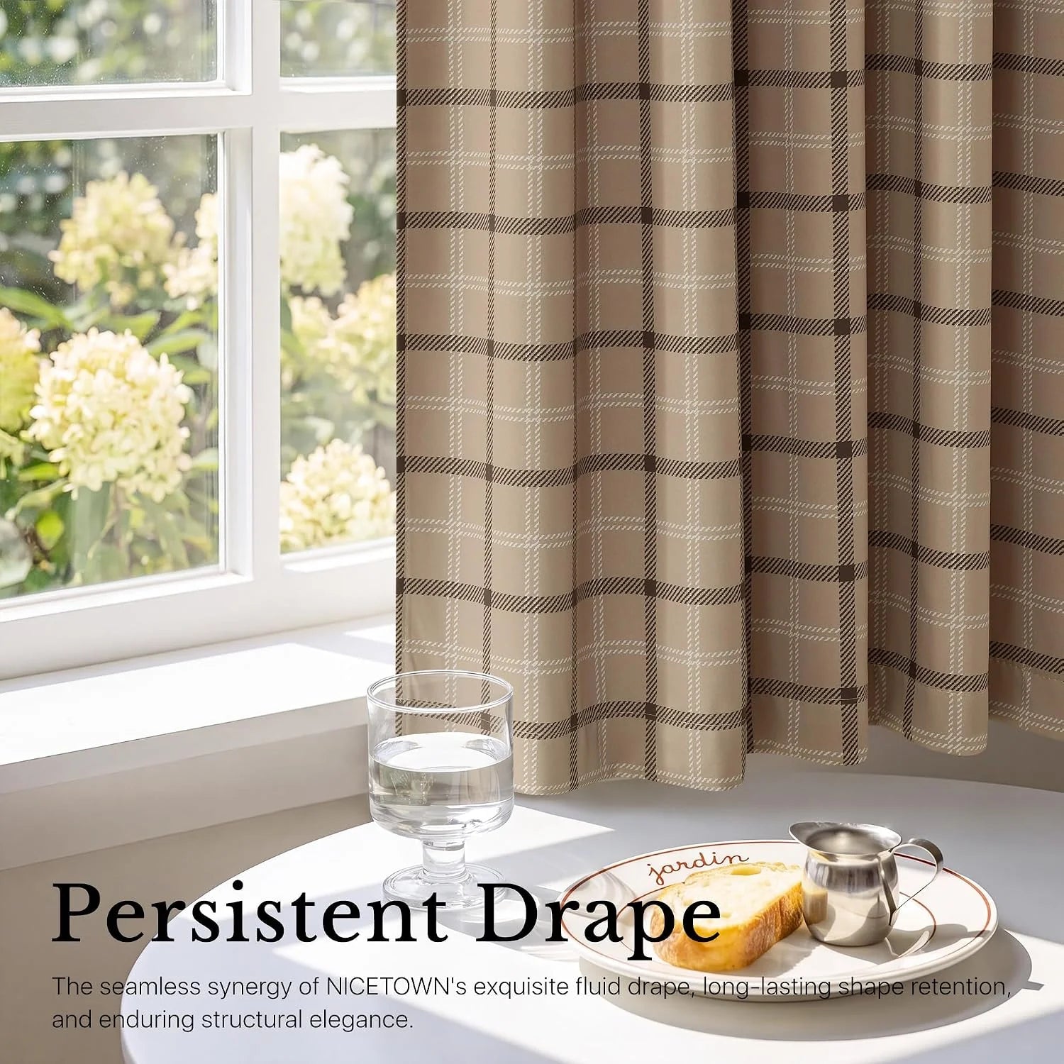 Beige plaid curtain panel draped beside a bright window with a breakfast table
