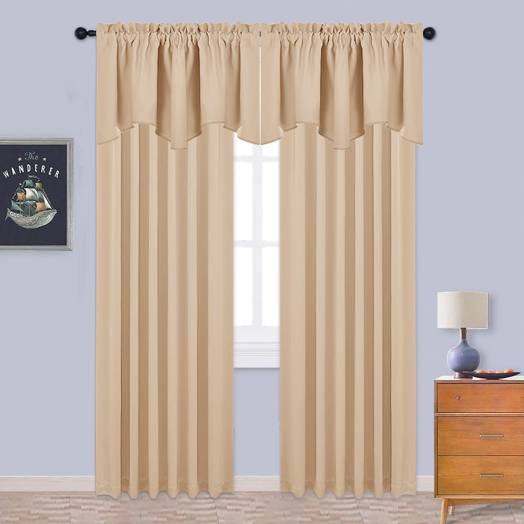 Beige rod pocket curtain panels with a decorative valance hung on a black rod over a window.