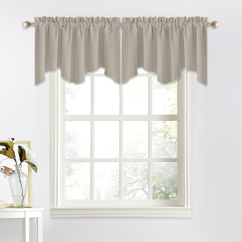 Beige scalloped rod pocket window valance on a brushed nickel rod over a white grid window.