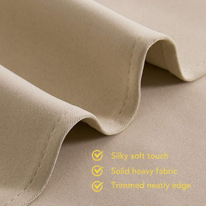 Beige curtain fabric with silky soft touch, heavy solid construction, and neatly trimmed edge.