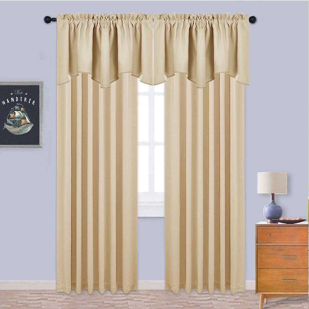 Beige solid curtains with a rod pocket top and matching scalloped valance hanging over a window.