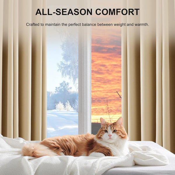 Beige solid thermal blackout curtains frame a window. A fluffy orange cat rests on a white blanket.