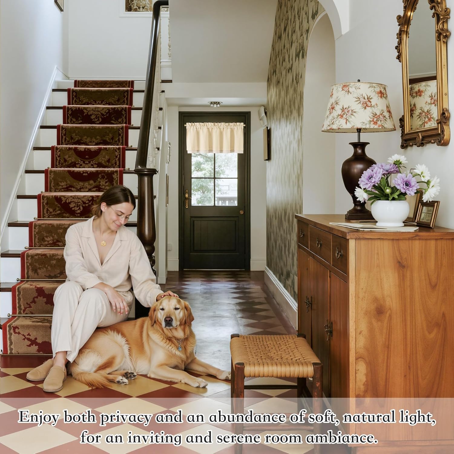 Light beige striped rod pocket valance curtain hanging above a dark wooden entryway door.