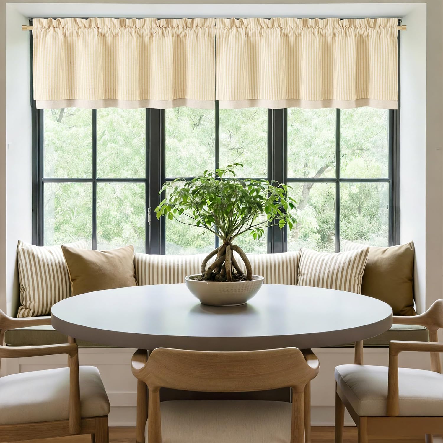 Beige striped rod pocket valance with gathered top and solid bottom band adds a cozy touch to a bright window.