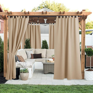 Beige tab top outdoor curtains on a pergola, providing privacy and shade for patio seating.