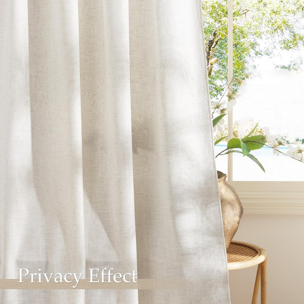 Beige textured linen-blend sheer curtains providing privacy, hanging in front of a bright window with outdoor view.