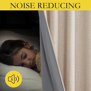 Beige textured noise-reducing curtain with grey lining, creating a dark room where a child sleeps peacefully.