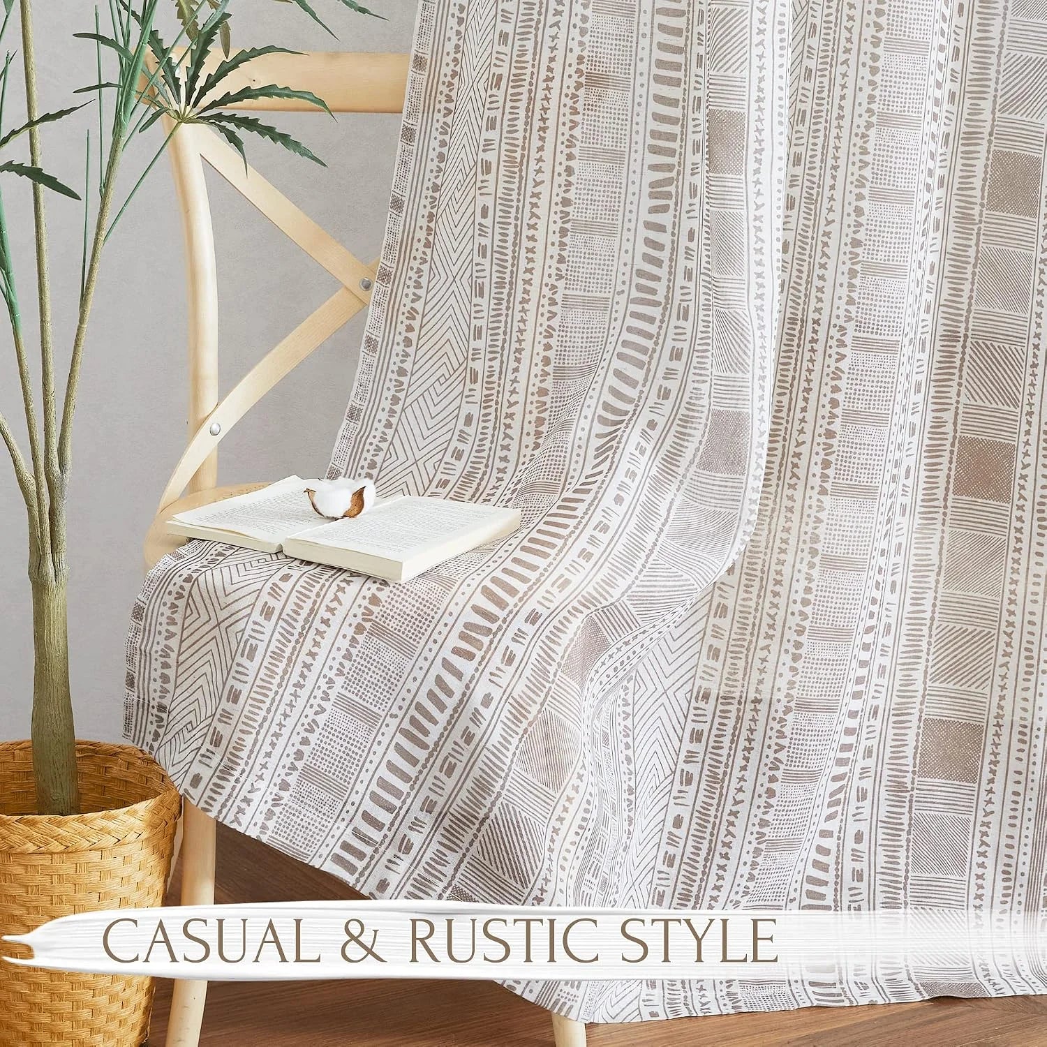 Beige tribal patterned fabric draped over a wooden chair in a rustic room