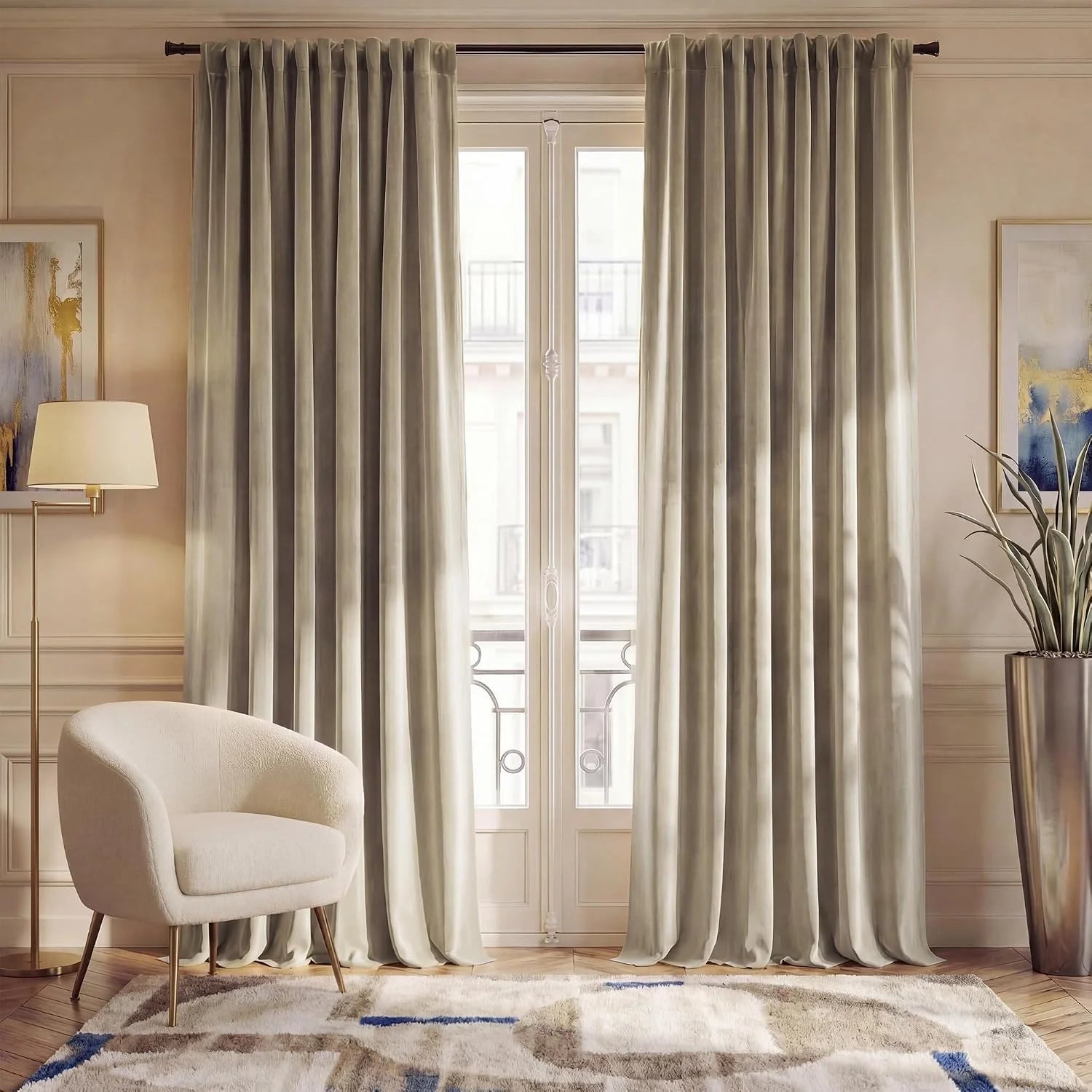 Beige velvet pleated curtains framing a tall window in an elegant neutral living room