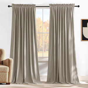Beige velvet rod pocket curtains, soft drape, on black rod. Autumn trees outside window.