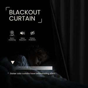 Black blackout curtain in a dark room with a sleeping child, demonstrating effective light blocking and privacy.