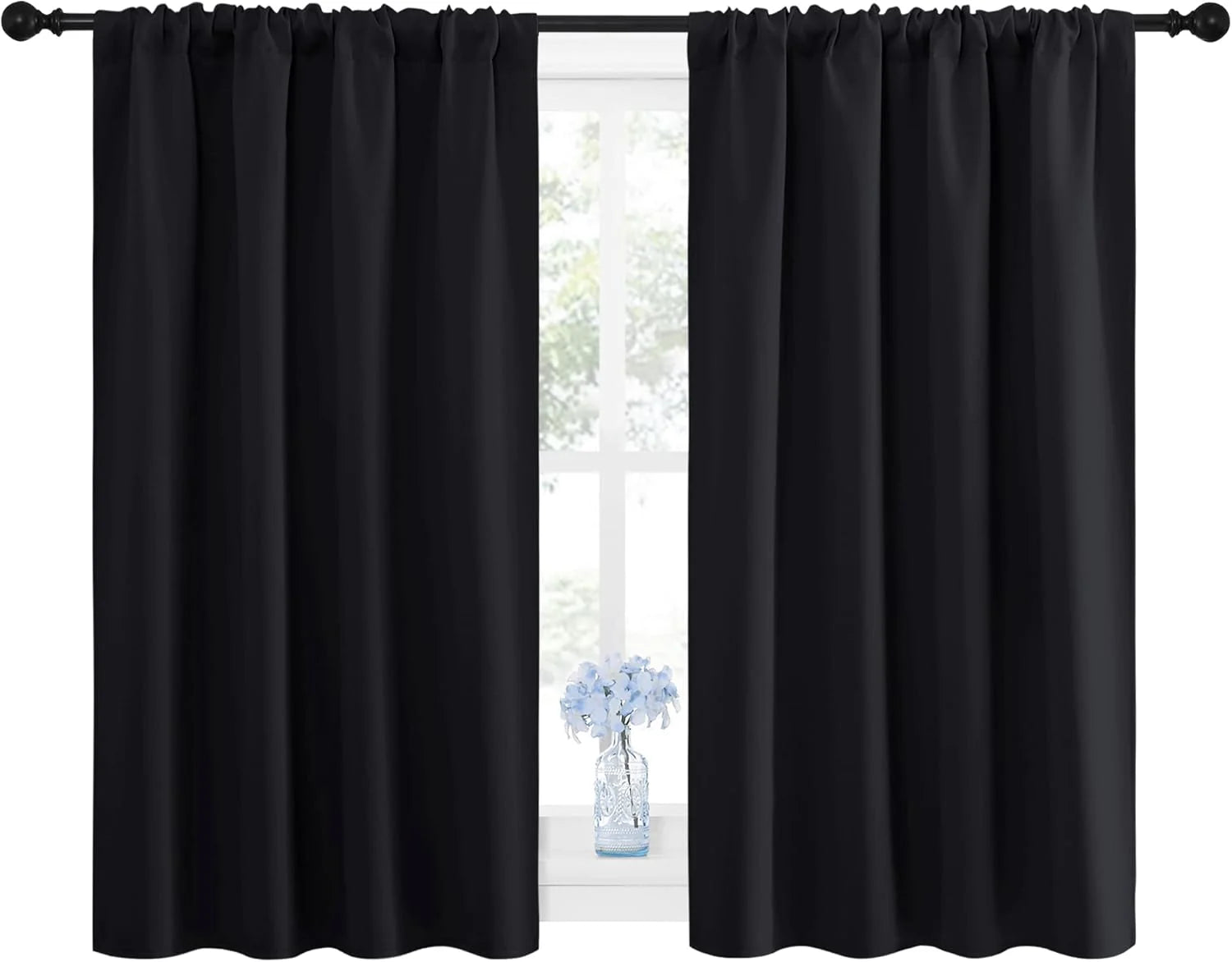 Pair of black blackout curtains with rod pocket top, with blue flowers on windowsill