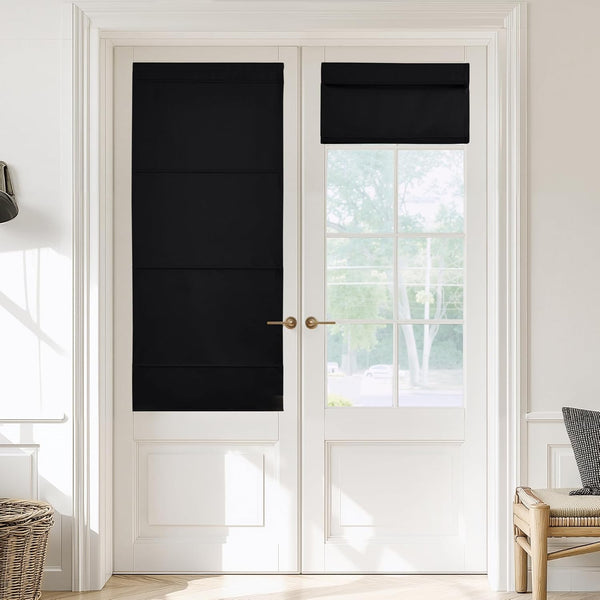Black blackout roman shades on white French doors, one fully extended for privacy, the other partially raised.