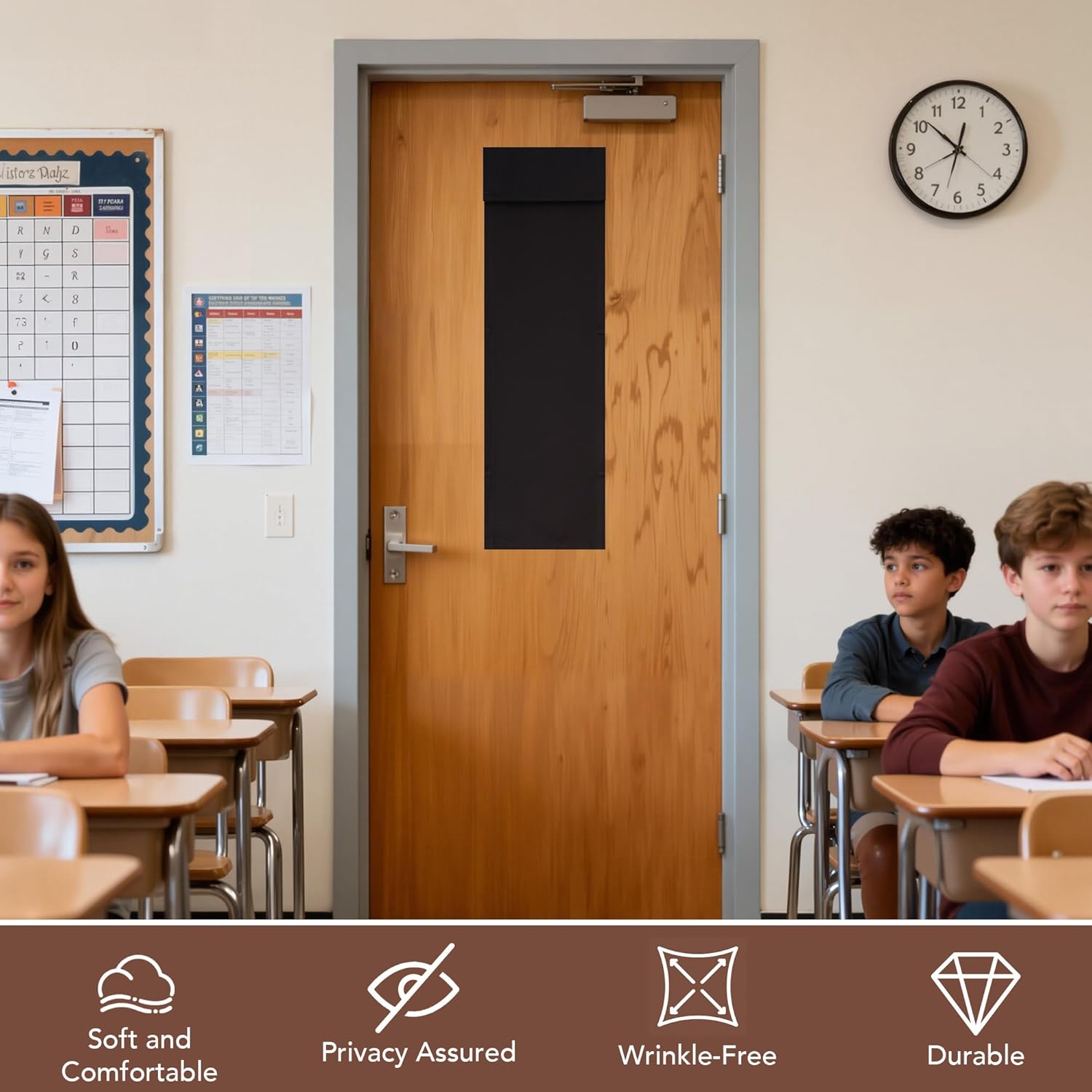 Black fabric privacy shade covering a rectangular window on a light wooden classroom door.