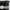 Close-up of a black curtain with shiny silver grommet top. The grommet measures 1.6 inches.