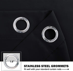 Close-up of black curtain fabric showing two shiny stainless steel grommets, one with a 1.6-inch diameter, designed for standard rods.