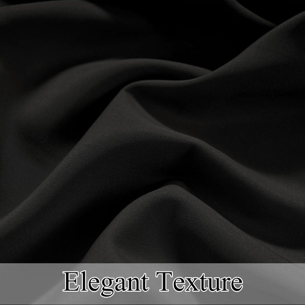 Close-up of elegant black finely woven fabric with soft drapes and subtle texture visible.