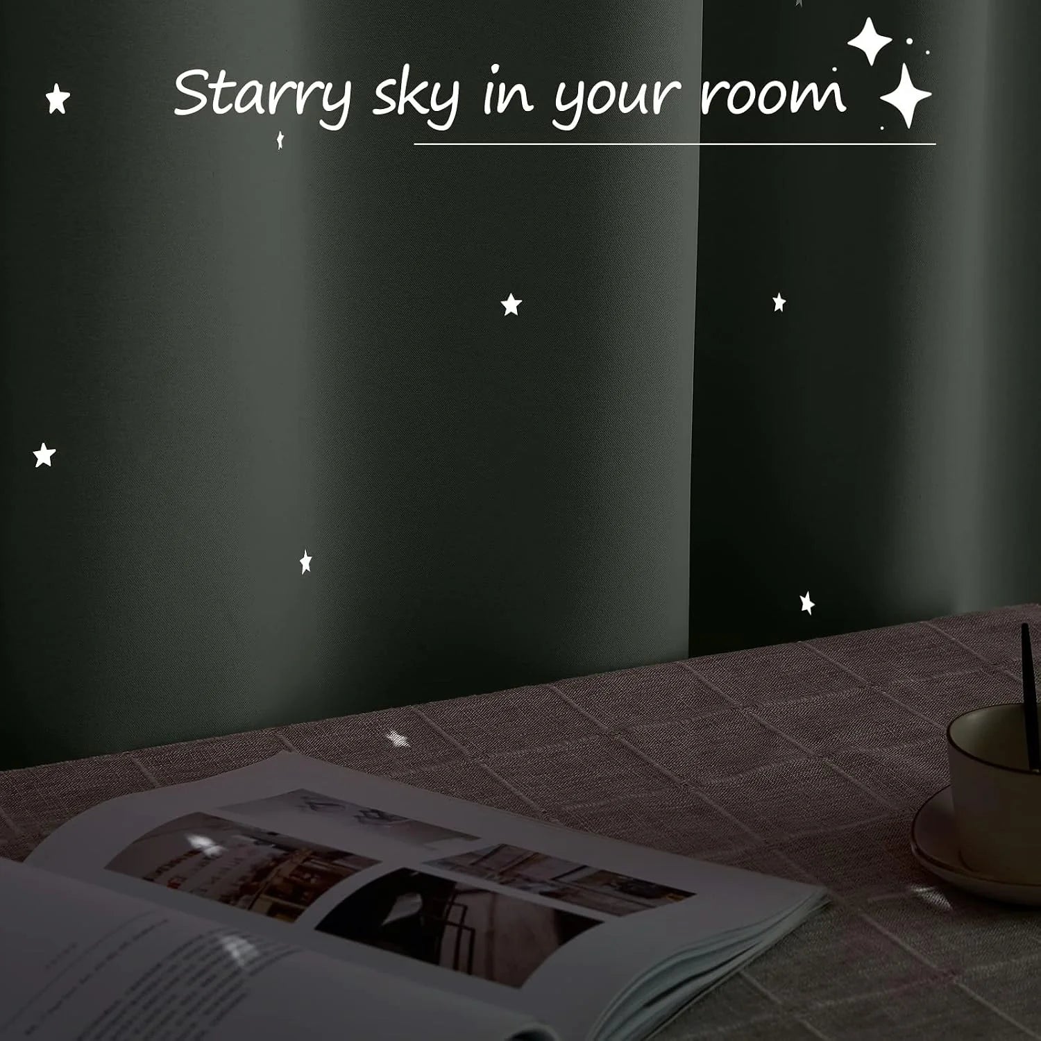 Black wall with glow-in-the-dark star decals above a table with book and mug