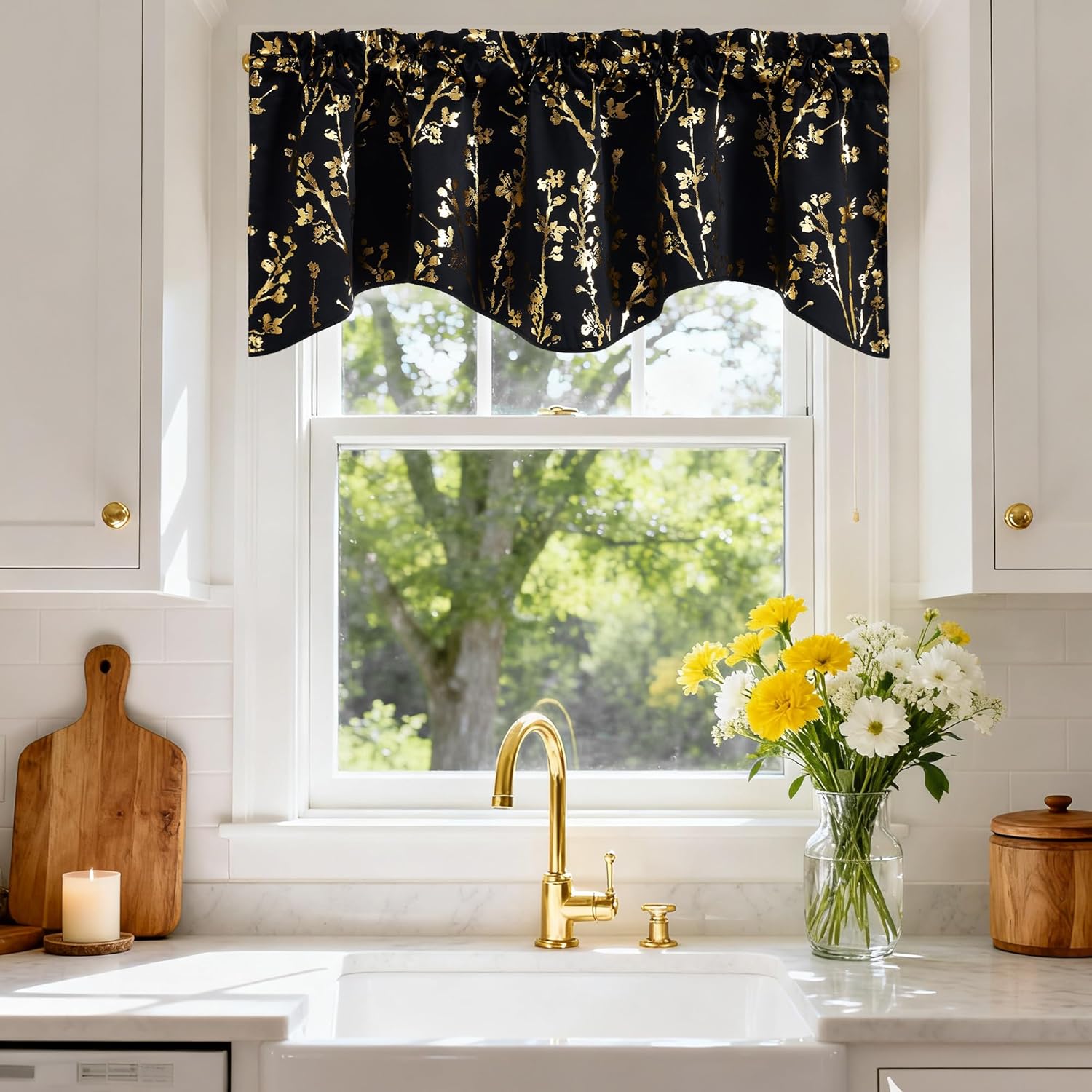 Black rod pocket valance with shimmering gold botanical print and scalloped edge over kitchen window.