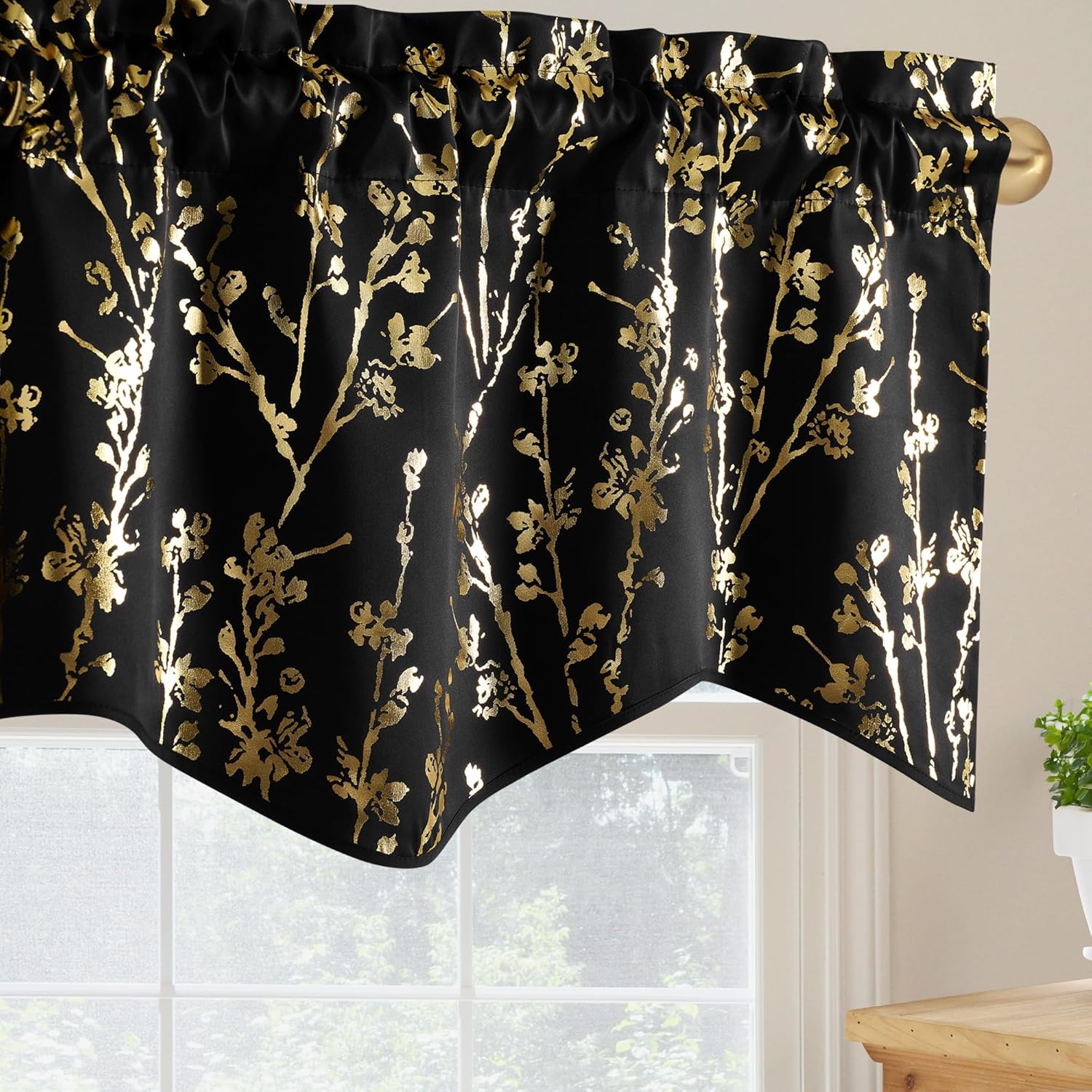 Black window valance with metallic gold floral tree branch pattern and rod pocket top.