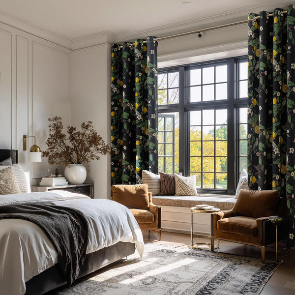 Black grommet top curtains with vibrant lemon, floral, and bird pattern.