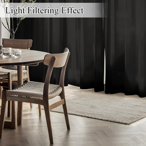 Black light filtering curtains in a modern dining room. Dark fabric, soft light.