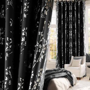 Blackout curtains featuring metallic cherry blossom print with grommet top in a bedroom.