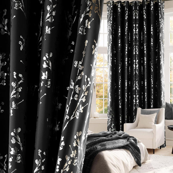 Blackout curtains featuring metallic cherry blossom print with grommet top in a bedroom.