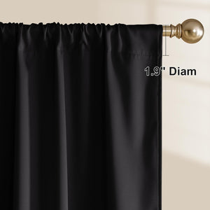 Black rod pocket curtain panel with a gathered top, hanging on a bronze-gold curtain rod.