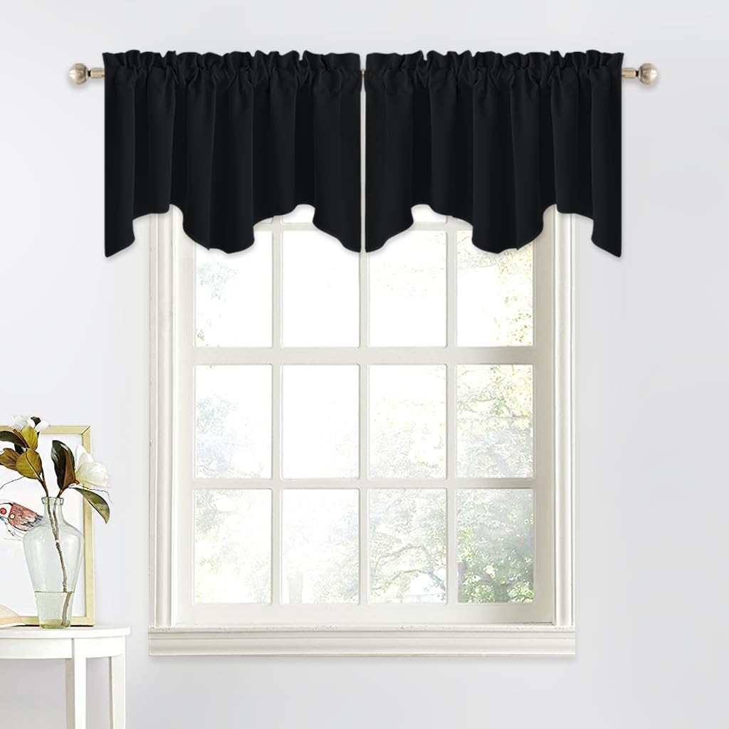 Black solid valance curtains with a scalloped bottom edge and rod pocket top, hung on a window.
