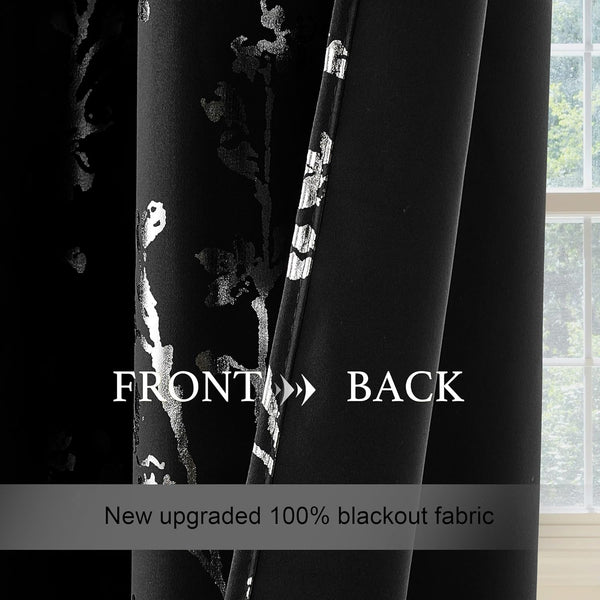 Blackout curtain with shimmering silver floral pattern on the front and plain black back, made from 100% blackout fabric.