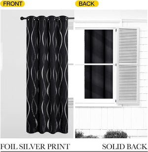 Black grommet curtain with silver foil wavy print on the front, revealing its solid black blackout back.