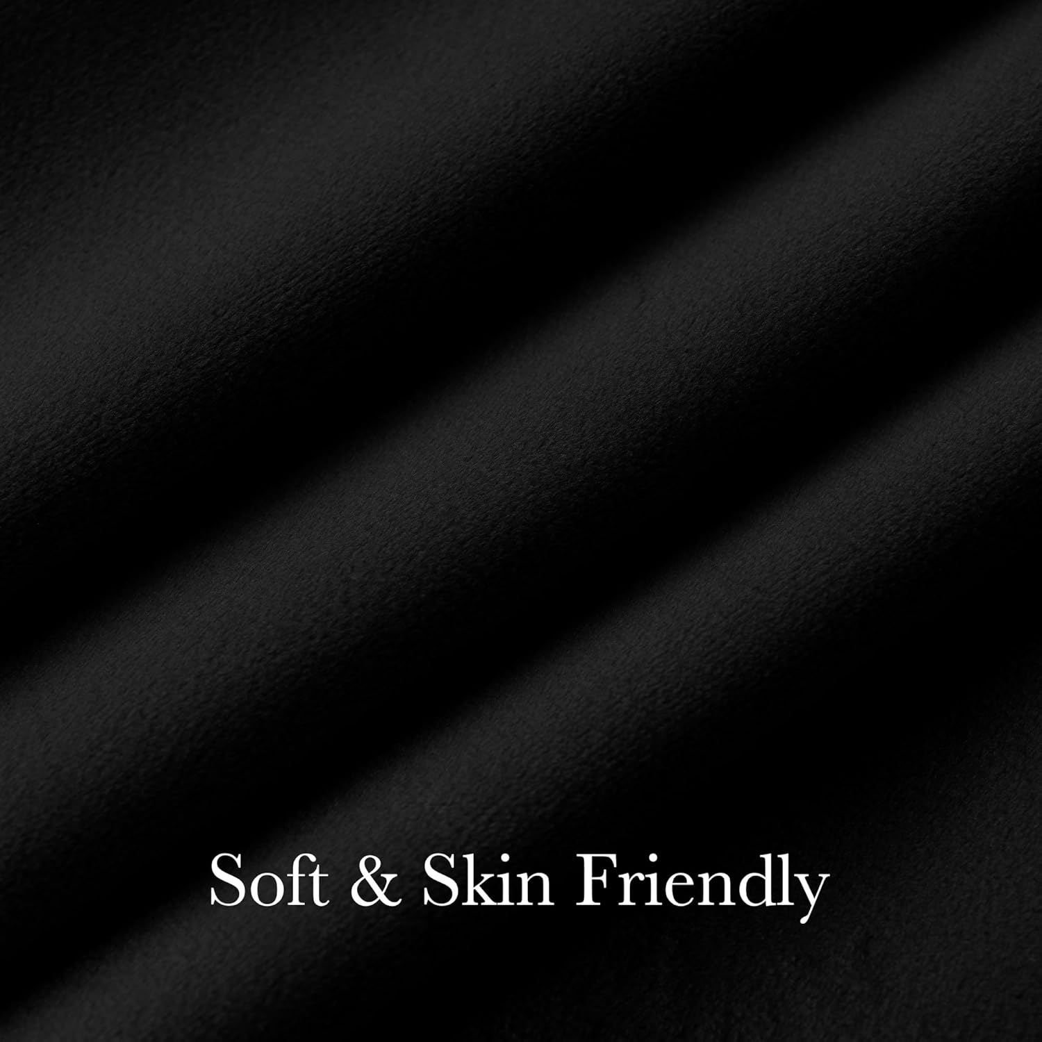 Close-up of draped black fabric with a soft, skin-friendly texture and gentle folds