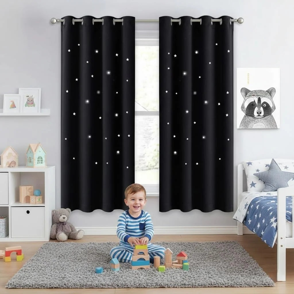 Black star-print blackout curtains in a kids bedroom with toddler playing on gray rug