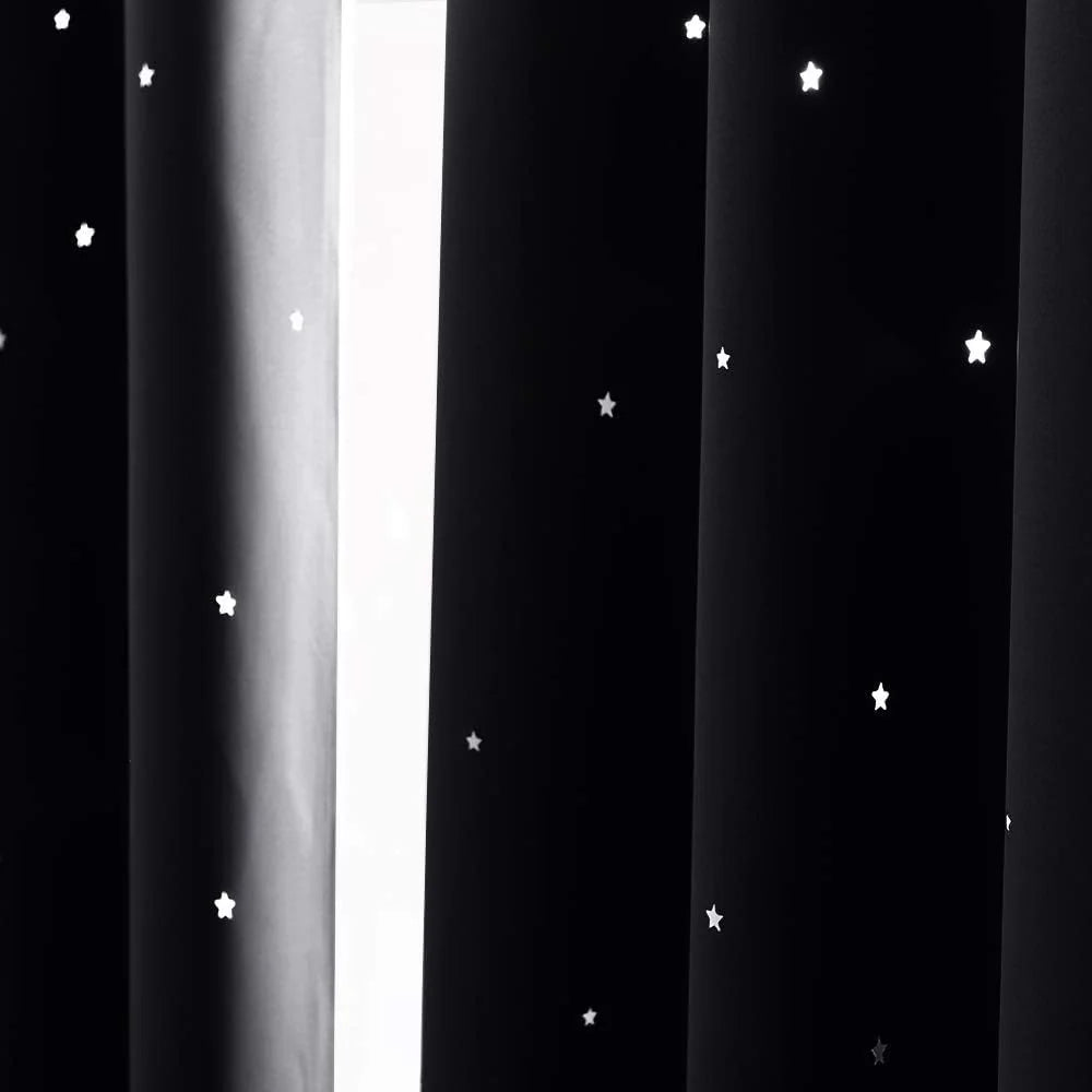 Black blackout curtains with scattered white star pattern and soft pleats