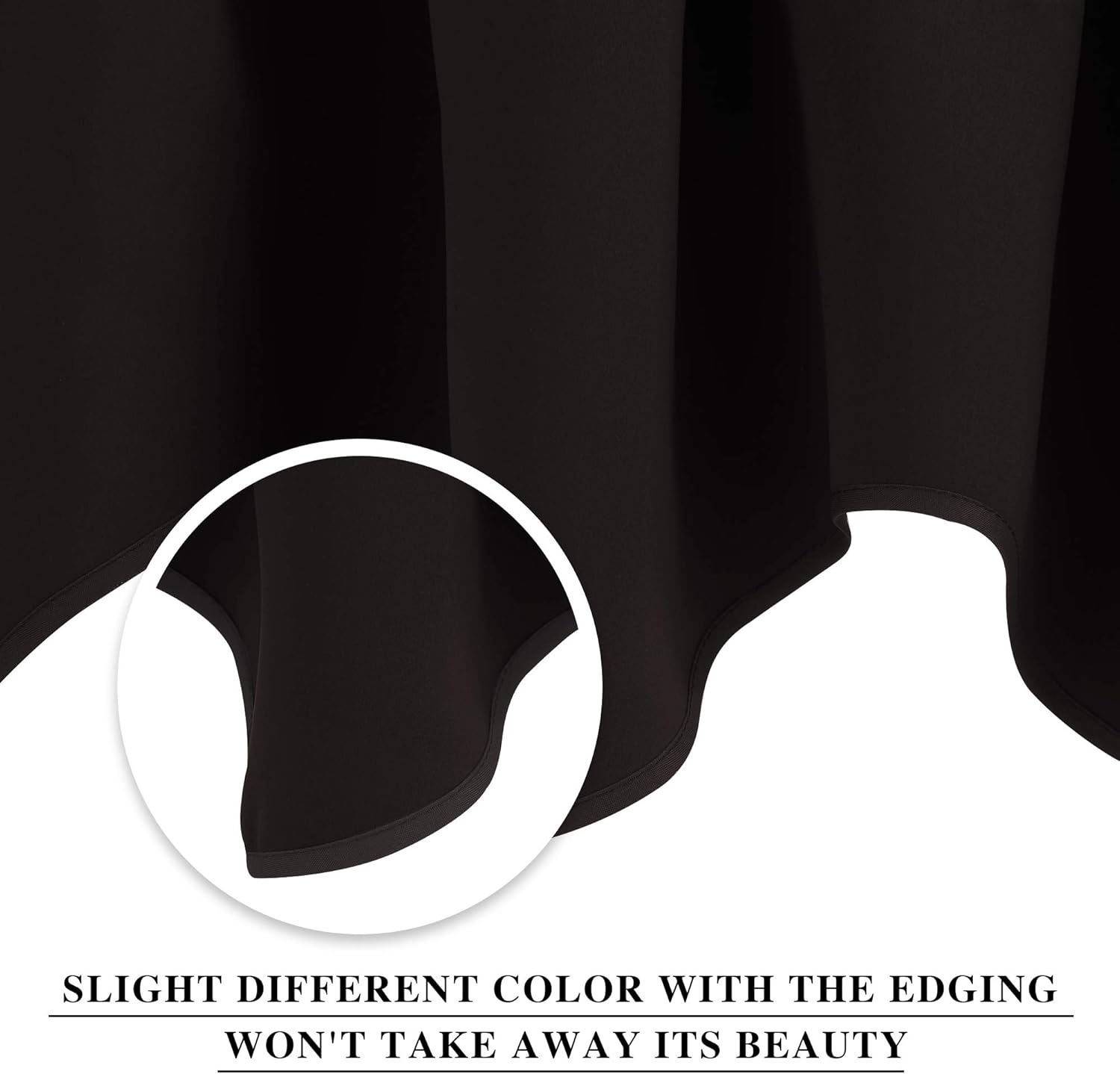 Close-up of black textile fabric with elegant drape, showcasing subtle color variation in the finished bottom edging.