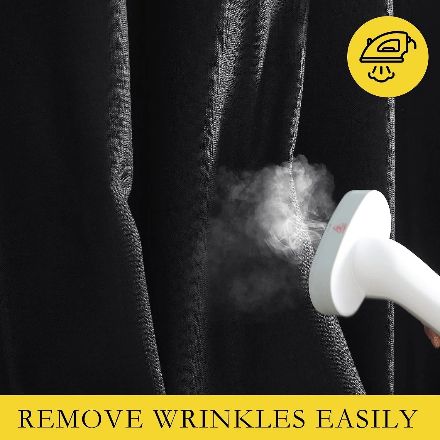 White garment steamer removing wrinkles from black textured curtain fabric